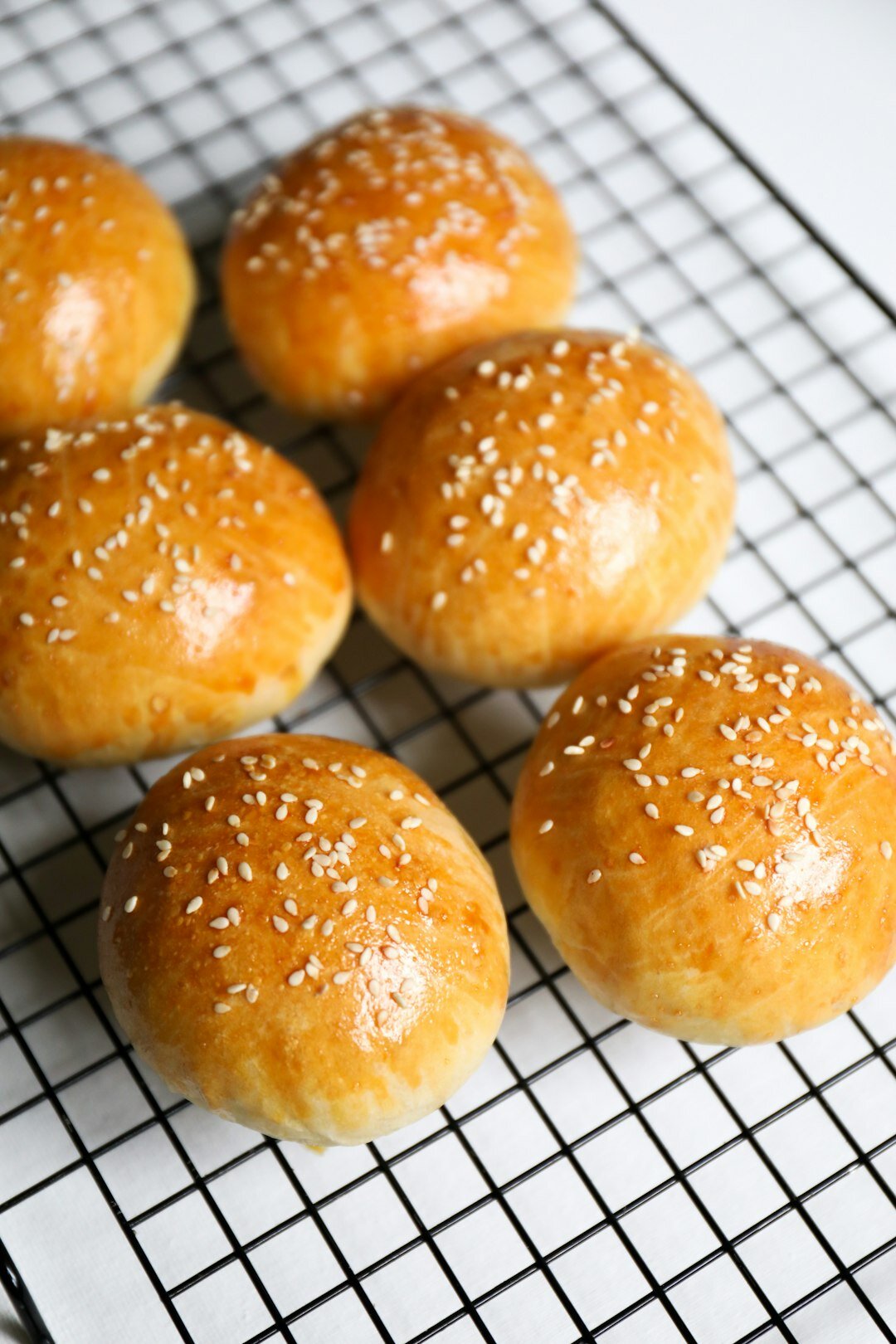 Fresh baked Czech kolache pastries on a cooling rack