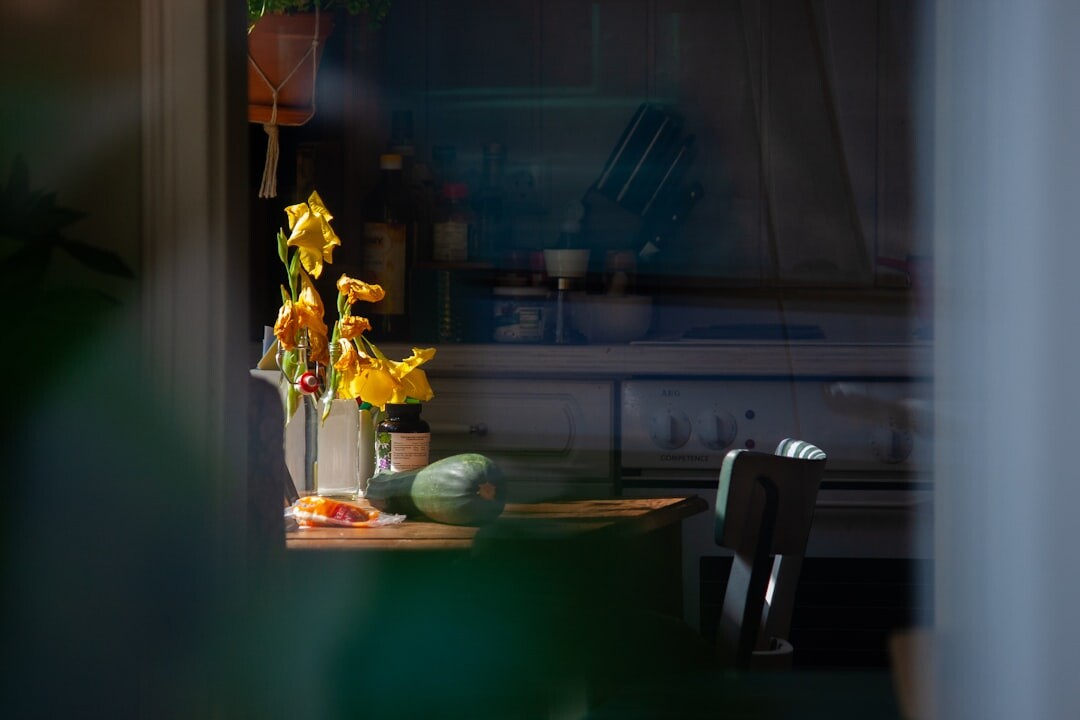 Fresh spring vegetables and herbs on a kitchen table