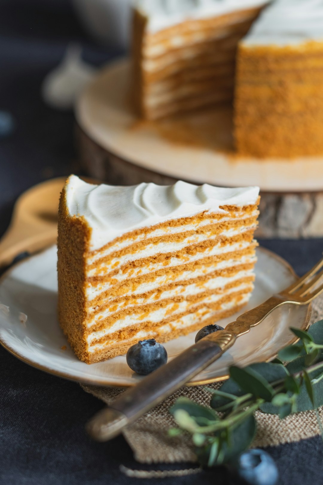 Slice of traditional Czech honey cake on a ceramic plate