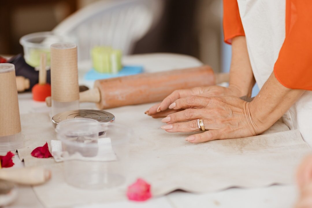 Czech grandmother baking buchty in a home kitchen
